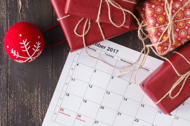 istock Modern gifts on a wooden rustic table with copy space. Christmas background 882102110