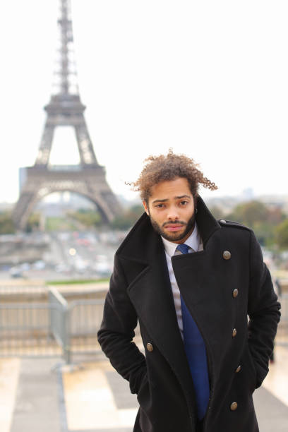 istock male model smiling near Eiffel Tower 882111968
