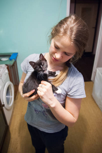istock Woman with black kitten 882112444