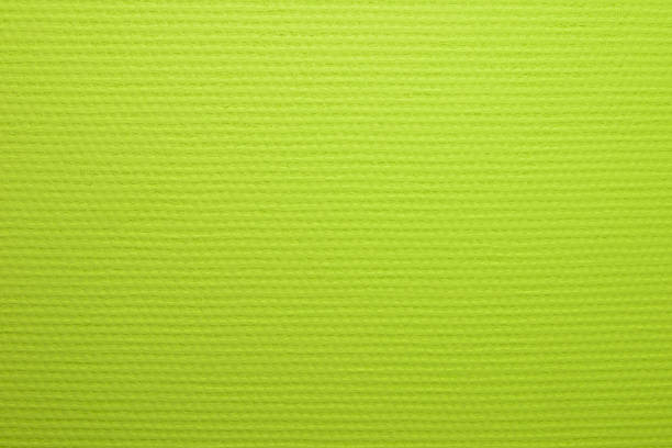painted in lime color wallpaper with a texture of large matting - fake rattan imagens e fotografias de stock