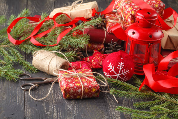 istock gifts boxes with fir branches on wooden background 882132056