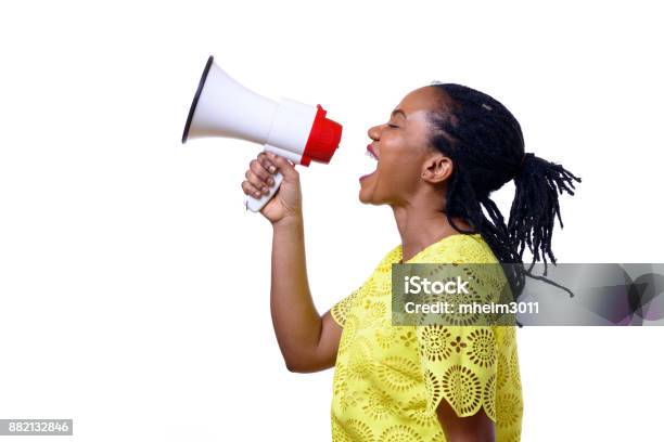 African American Woman Shouting At Megaphone Stock Photo - Download Image Now - Megaphone, Women, White Background