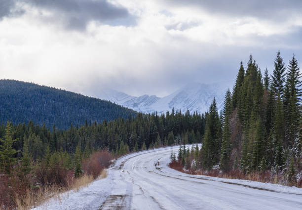 istock Winter road in the mountains, Kananaskis, Alberta, Canada 882144736