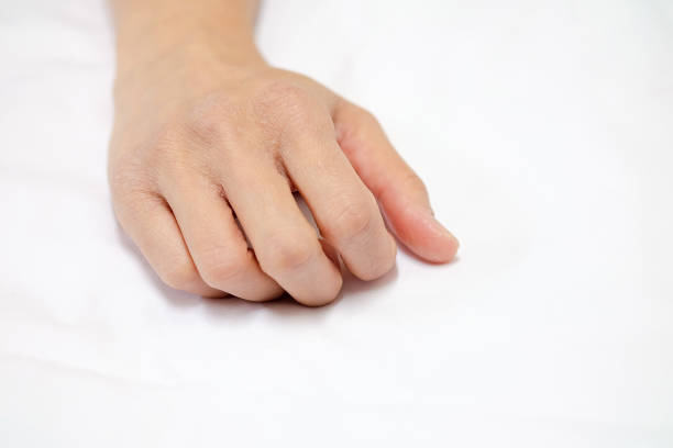 istock Female hands drying on a white fabric background. 882153638