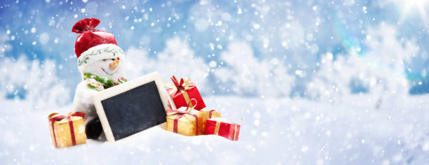 istock Cute Christmas Snowman with Presents on the Snow 882157440