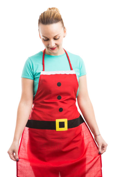 istock Woman wearing and presenting red Christmas apron 882168538