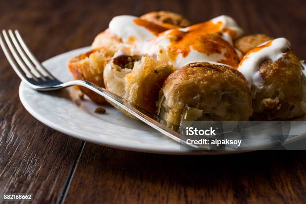 Bosnian Pastry Manti With Yogurt And Fried Butter Sauce Bosnak Borek Stock Photo - Download Image Now