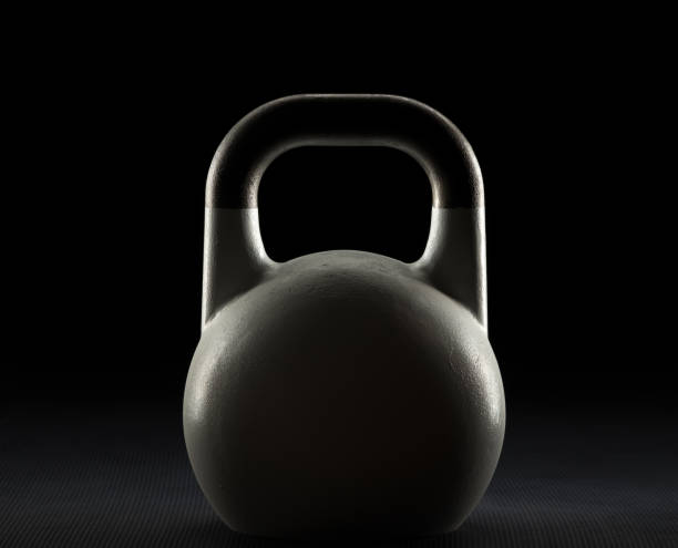 istock Weight training kettlebell silhouette on a weight training gym floor 882186370
