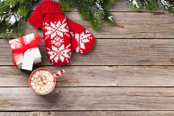 istock Christmas fir tree, mittens, hot chocolate with marshmallow 882186704