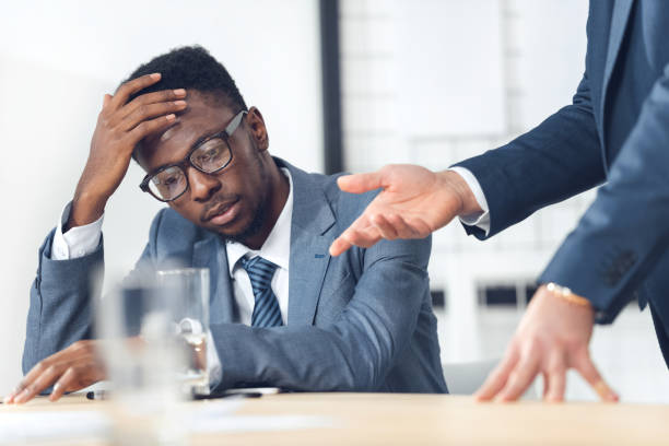 istock businessman listening to boss 882189918
