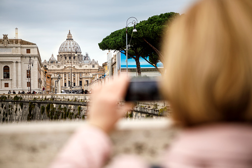 Tourist taking photos in Vatican city, Rome