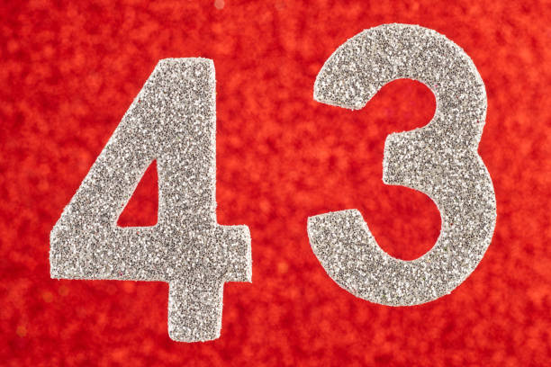 istock Number forty-three silver color over a red background. Anniversary 882191010