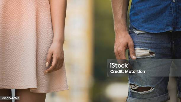 Young Male And Female Standing Next To Each Other Couple Breaking Up Closeup Stock Photo - Download Image Now