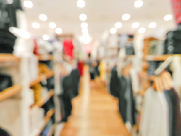 Blurred customer in clothing shop