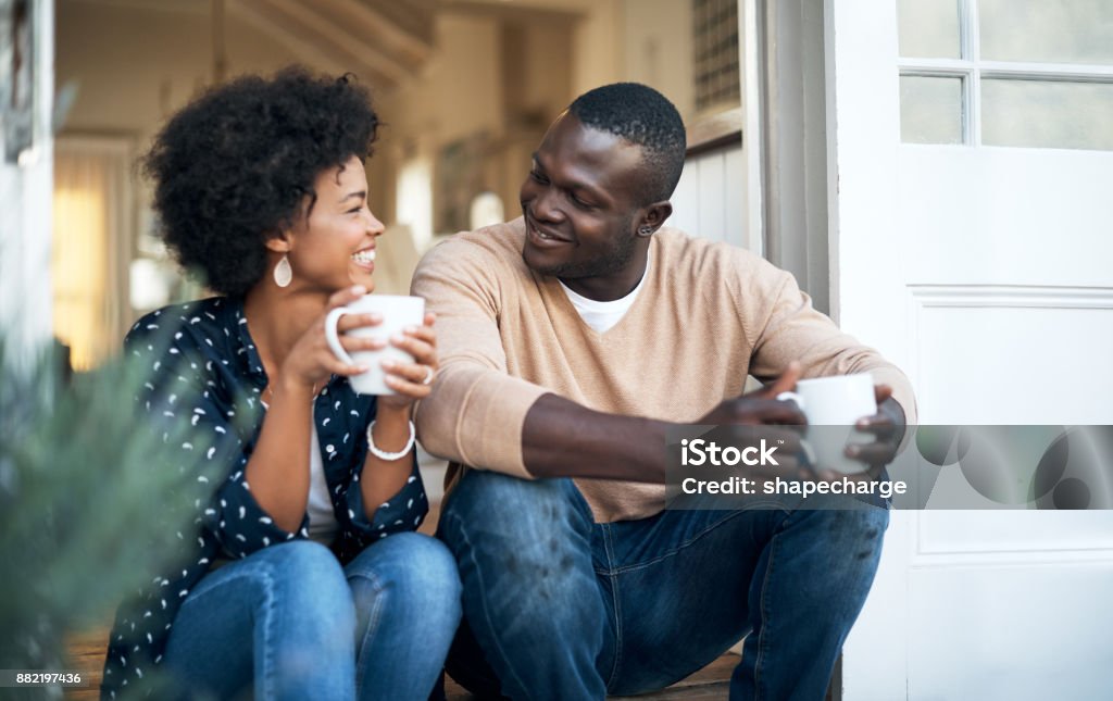 We’re so comfortable with each other Cropped shot of a happy young couple spending time together outside Discussion Stock Photo