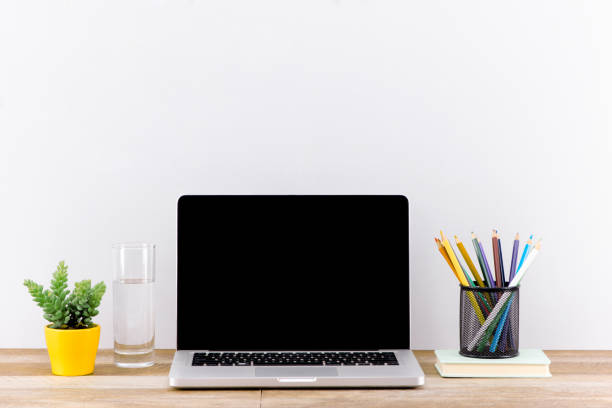 istock Mock up laptop, notebook on young student desk. Cyan pastel colors. 882198044