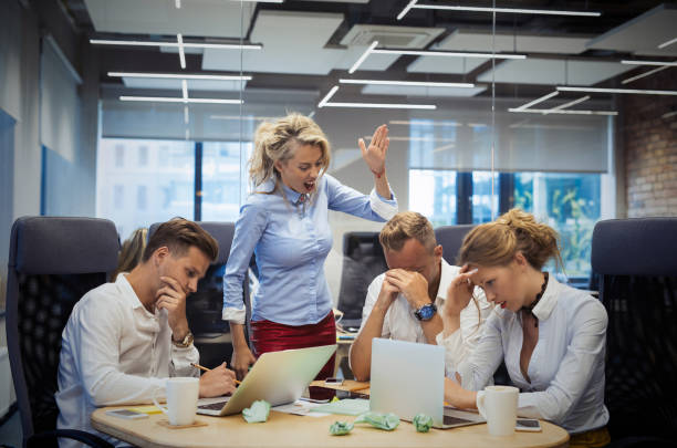 Mad boss showing gestures to employees Mad boss showing gestures to employees, concept of bossing Rudeness stock pictures, royalty-free photos & images