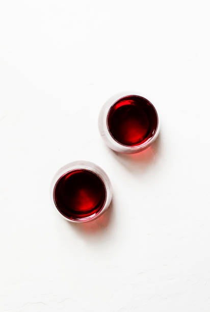 Red wine in glasses on a white background Red wine in glasses on a white background, top view shiraz stock pictures, royalty-free photos & images