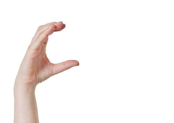 Hand held aloft, curved into C shape, holding copy space A hand is raised and curved into a C shape as though gripping something, but it's actually copy space for your product or copy. letter c hand stock pictures, royalty-free photos & images