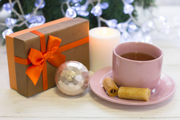 istock A festive still life with tea, a burning candle and a giftbox 882208098