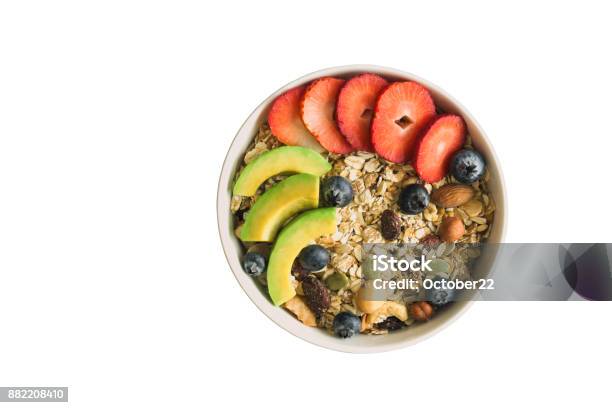 White Isolated Background With Clipping Paths Muesli Or Granola On White Bowl Top With Fresh Blueberries Strawberries And Avocado For Breakfast In Top View Flat Lay Healthy Food Concept Stock Photo - Download Image Now