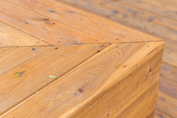 istock wooden background with fallen leaves 882216610