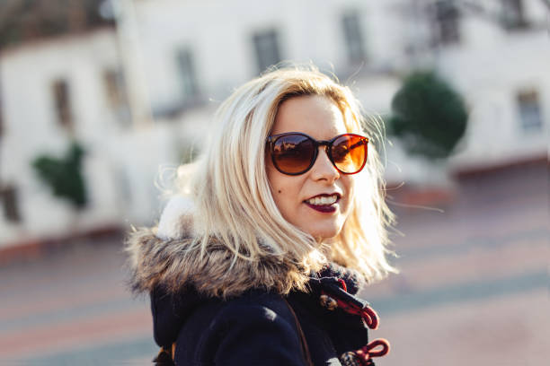 istock Charming woman portrait on autumn sun 882222144