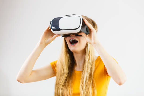 istock Girl wearing virtual reality goggles. 882225690