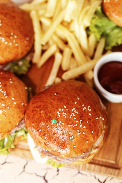 istock burgers with bacon, lettuce and sesame seeds 882229192
