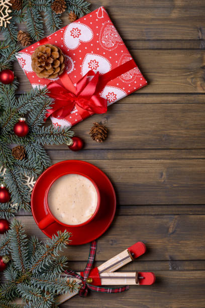 istock Coffee and gift box on Christmas wooden background 882229378