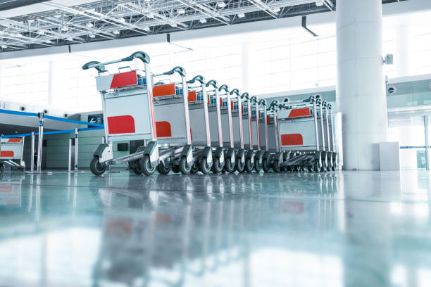 istock luggage carts at modern airport 882229472