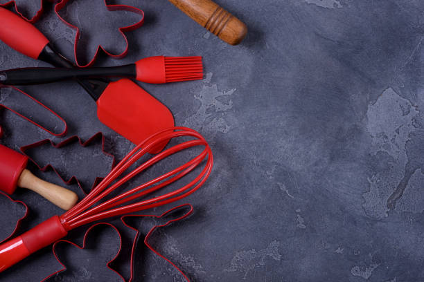 istock Red cookies cutters and kitchen utensols 882229544