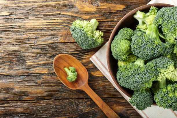 istock broccoli in a clay plate on a wooden table. 882229634