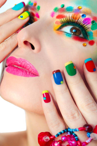 istock Multi-colored French manicure and make-up. 882229954