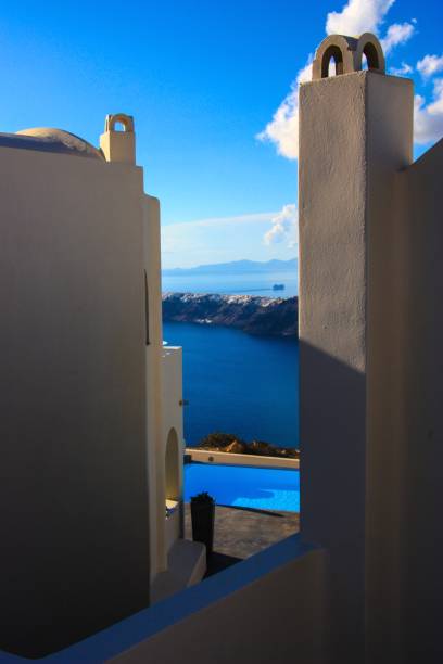 istock apartment with a pool overlooking oia 882232750