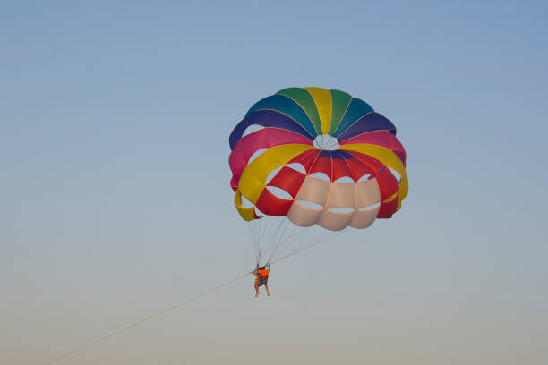 istock people in a bright parachute 882232828