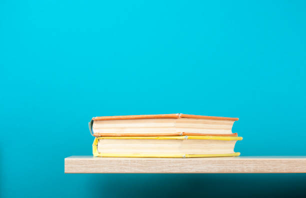 istock Stack of books on wooden shelf. Education background. Back to school. Copy space for text. 882232944