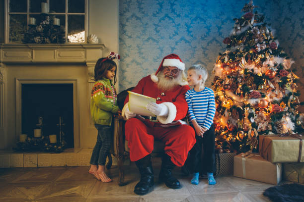 istock Santa reading fairy tales 882236526
