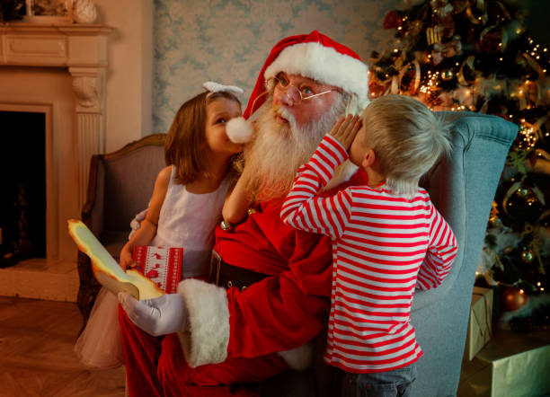 istock Santa reading fairy tales 882239110