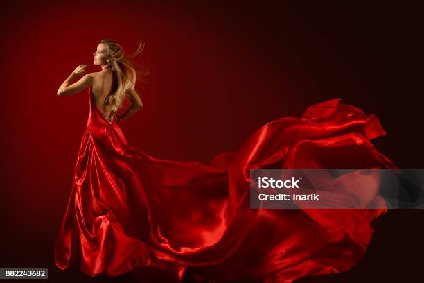 Fashion Model Dance In Red Dress Happy Dancing Woman Flying Fluttering Fabric Rear View Stock Photo - Download Image Now