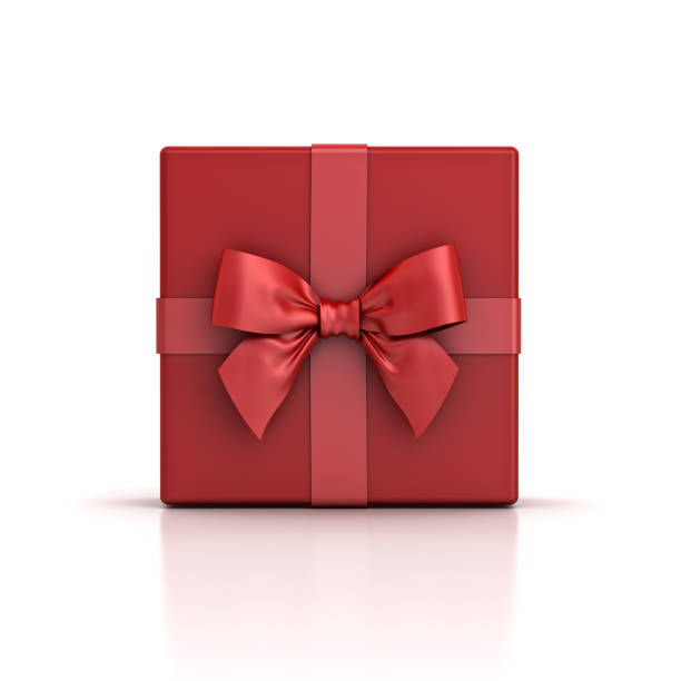 Red gift box or red present box with red ribbon bow isolated on white background with shadow and reflection stock photo