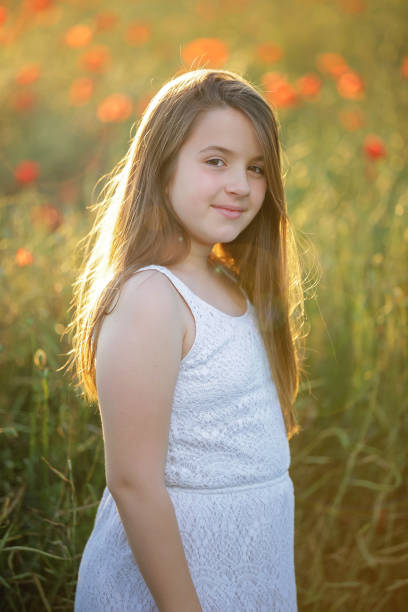 istock Girl in poppy field 882255066