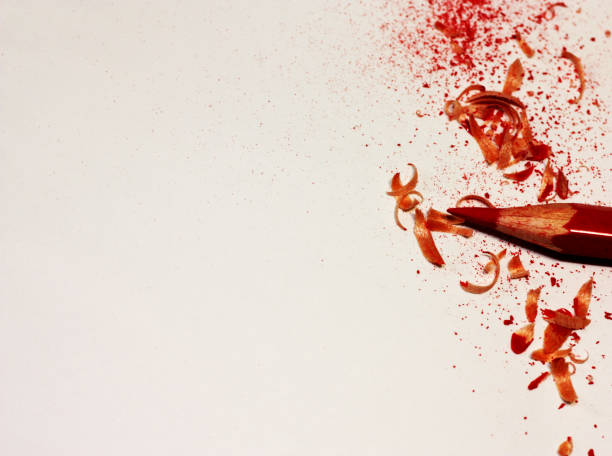 istock Red Pencil and crayon shavings close-up with place for your text or other design elements. 882258594