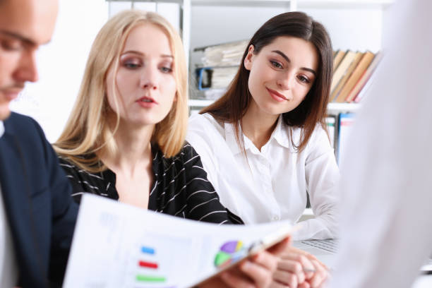 istock Group of people hold silver pen ready to make 882259330
