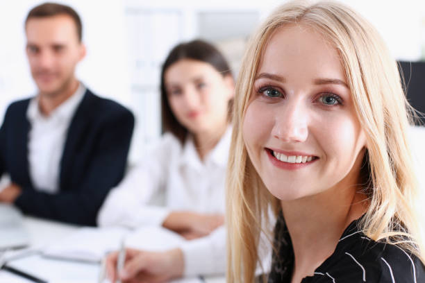 istock Beautiful smiling cheerful girl at workplace 882259406
