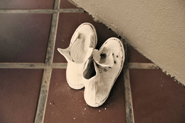 istock White washed sneakers on the floor 882259578