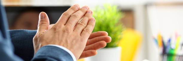 man in suit clap his arms congrats - hands clasped business education cooperation imagens e fotografias de stock