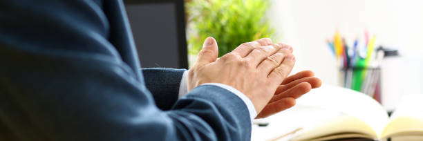 man in suit clap his arms congrats - hands clasped business education cooperation imagens e fotografias de stock