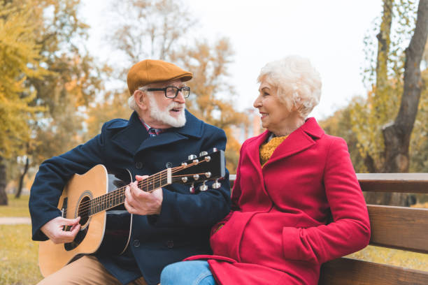 istock senior couple with acoustic guitar 882273776