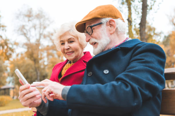 istock senior couple with smartphone 882279994